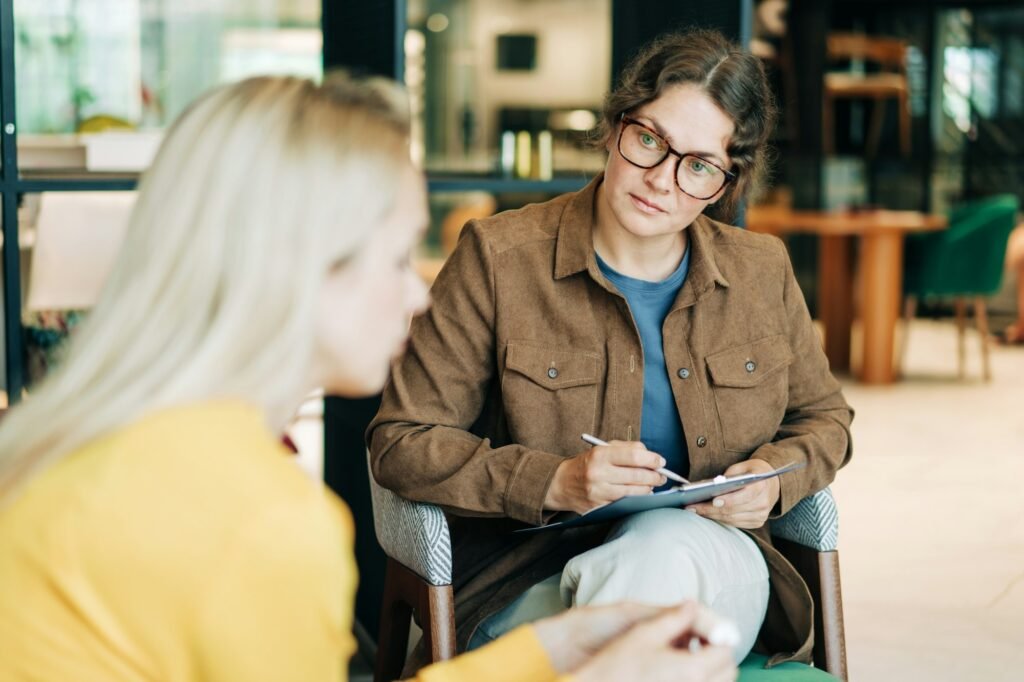 A female psychologist is counseling a depressed client