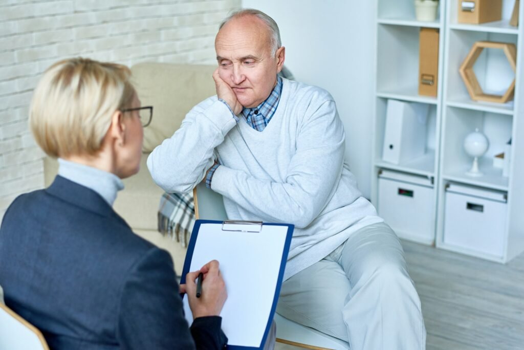 Depressed Senior Man in Therapy Session