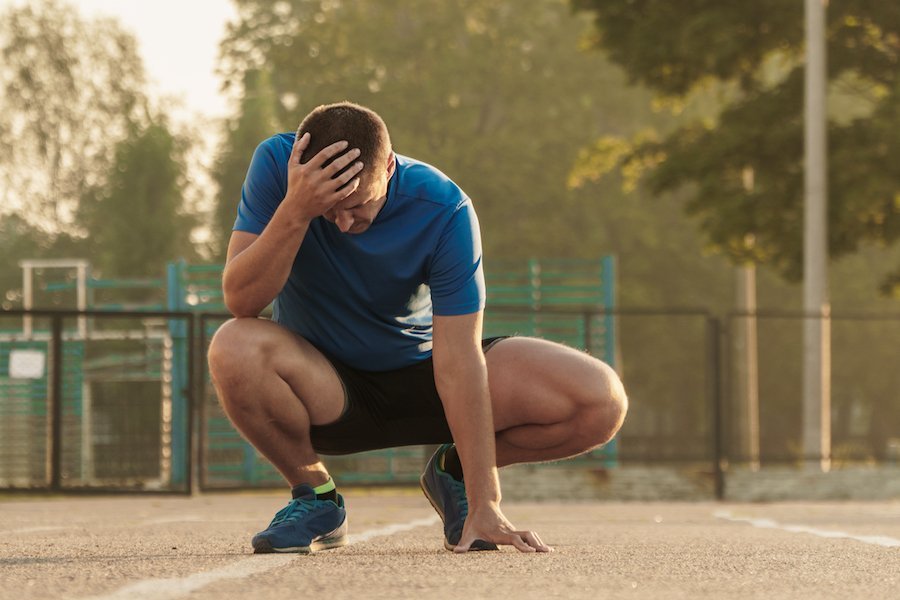 man having headache at the field