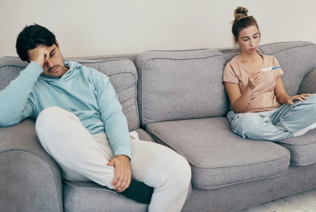 woman holding a pregnancy test