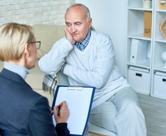 Depressed Senior Man in Therapy Session