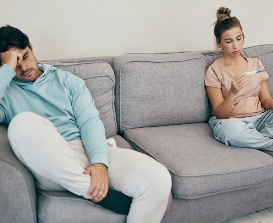 woman holding a pregnancy test